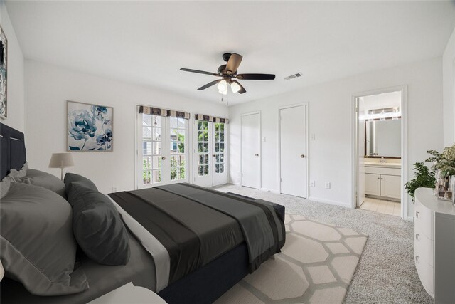 5827 Valley Forge Dr Unit 83, Houston, TX 77057 - bedroom featuring light colored carpet, ensuite bathroom, baseboards, ceiling fan, and multiple closets