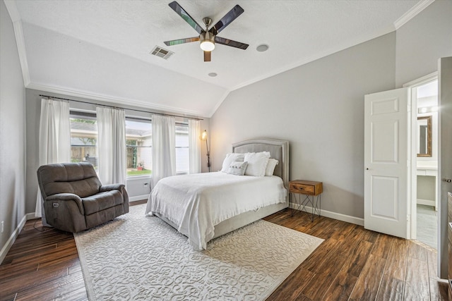 bedroom with hardwood / wood-style floors, visible vents, baseboards, lofted ceiling, and ornamental molding