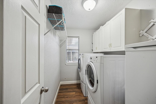 laundry room with independent washer and dryer, a textured ceiling, baseboards, dark wood-style flooring, and cabinet space