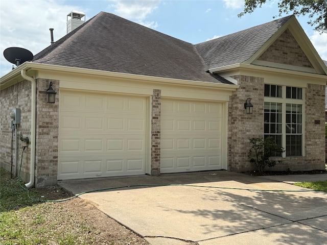 17235 Eden Falls Ct, Houston, TX 77095 - view of side of property featuring roof with shingles, an attached garage, driveway, brick siding, and a chimney