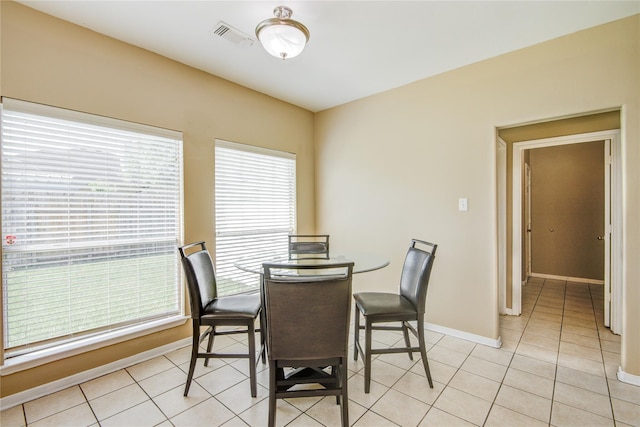 2810 Green Lodge Cir, Spring, TX 77373 - dining space featuring light tile patterned flooring, baseboards, and visible vents