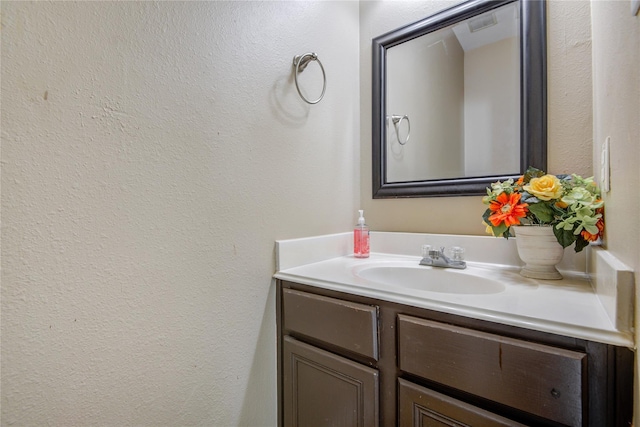 2810 Green Lodge Cir, Spring, TX 77373 - bathroom with vanity and a textured wall