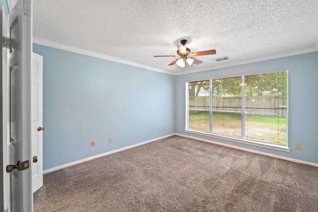 unfurnished room with ceiling fan, a textured ceiling, visible vents, ornamental molding, and carpet flooring
