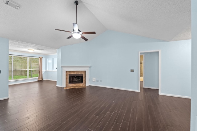 unfurnished living room featuring ceiling fan, baseboards, vaulted ceiling, visible vents, and dark wood-style floors