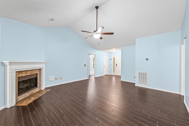 unfurnished living room featuring baseboards, a ceiling fan, dark wood-type flooring, and visible vents