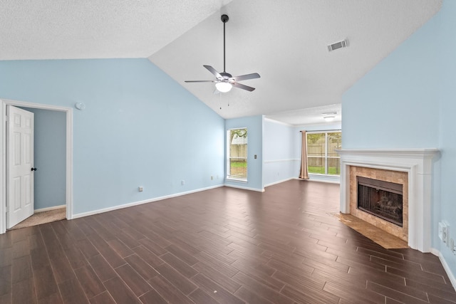unfurnished living room featuring dark wood-style flooring, ceiling fan, baseboards, vaulted ceiling, and visible vents