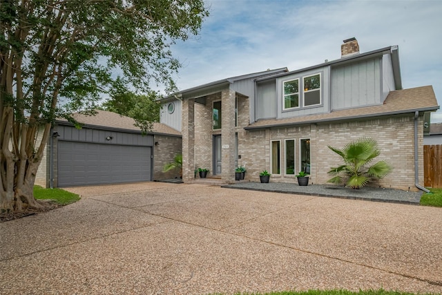 1709 Coles Farm Dr, Sugar Land, TX 77478 - view of front of house featuring brick siding, a chimney, driveway, and an attached garage