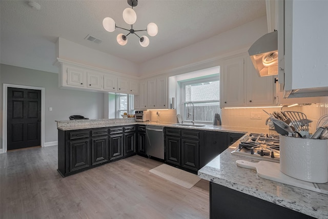 1709 Coles Farm Dr, Sugar Land, TX 77478 - kitchen with dark cabinetry, dishwasher, exhaust hood, and white cabinets