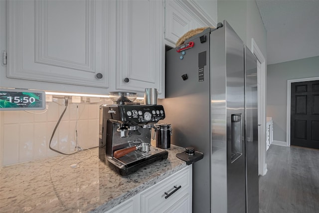 1709 Coles Farm Dr, Sugar Land, TX 77478 - kitchen featuring stainless steel fridge, white cabinetry, decorative backsplash, light stone counters, and wood finished floors