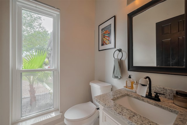 1709 Coles Farm Dr, Sugar Land, TX 77478 - half bath with vanity, toilet, and healthy amount of natural light