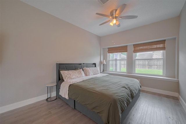1709 Coles Farm Dr, Sugar Land, TX 77478 - bedroom with baseboards, wood finished floors, and a ceiling fan