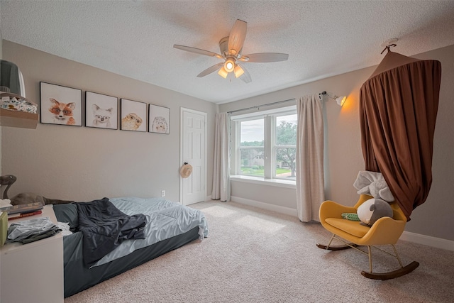 1709 Coles Farm Dr, Sugar Land, TX 77478 - bedroom featuring carpet flooring, a textured ceiling, baseboards, and a ceiling fan