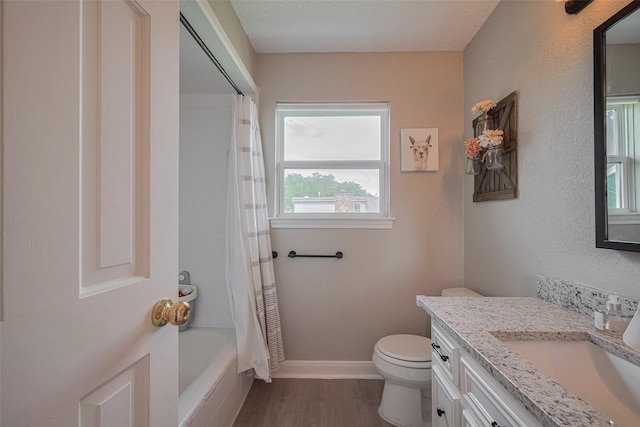 1709 Coles Farm Dr, Sugar Land, TX 77478 - full bathroom featuring vanity, toilet, wood finished floors, shower / tub combo, and baseboards