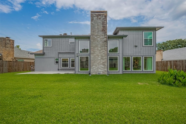 1709 Coles Farm Dr, Sugar Land, TX 77478 - back of property with a patio, a chimney, and board and batten siding