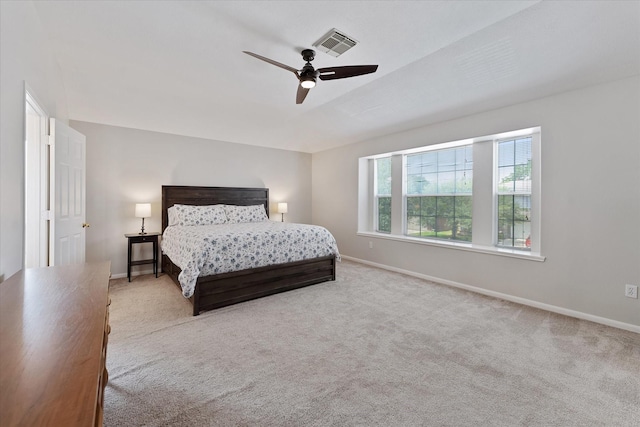 carpeted bedroom featuring baseboards and ceiling fan