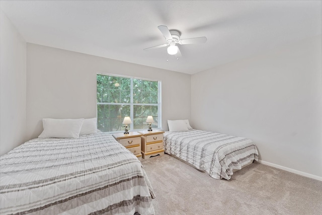 carpeted bedroom with a ceiling fan