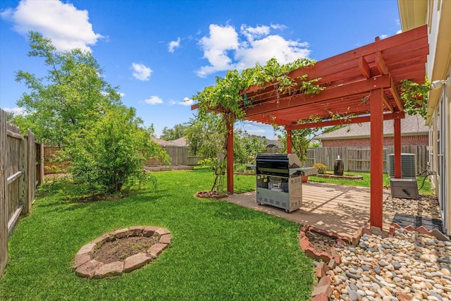 view of yard with a pergola, a patio area, and central air condition unit