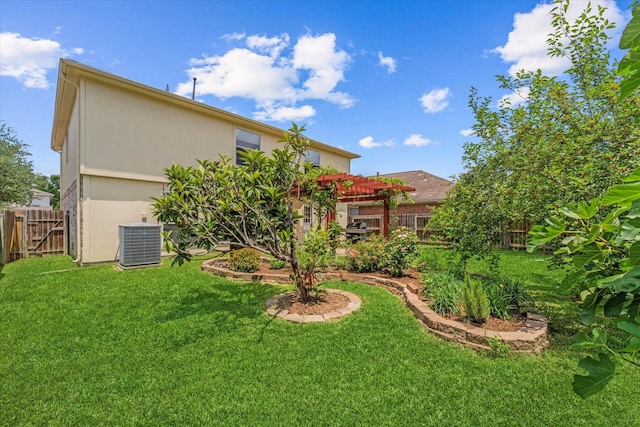 view of yard with a pergola and central AC unit