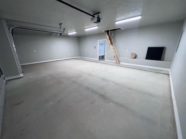 7510 Tram Rd, Beaumont, TX 77713 - garage with baseboards and a garage door opener