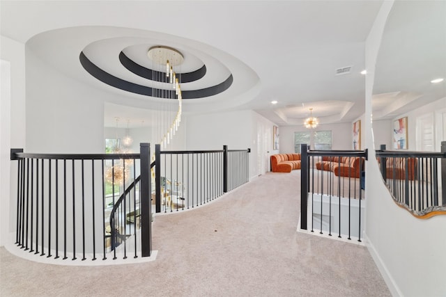 18114 Harbor Trail Ln, Conroe, TX 77302 - hallway featuring carpet floors, recessed lighting, a raised ceiling, a chandelier, and an upstairs landing