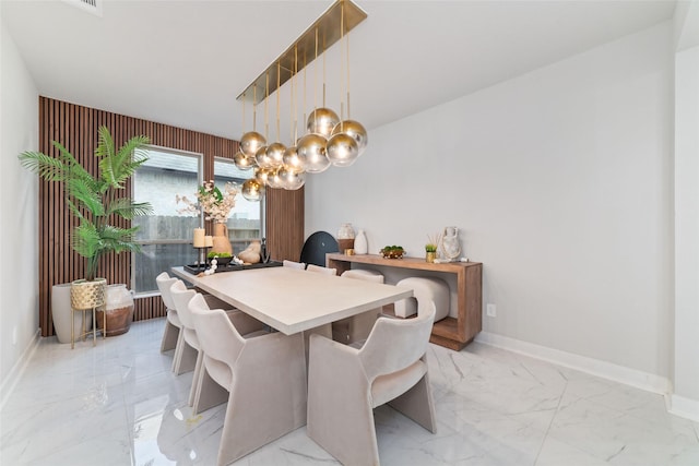 18114 Harbor Trail Ln, Conroe, TX 77302 - dining room featuring an inviting chandelier, marble finish floor, and baseboards