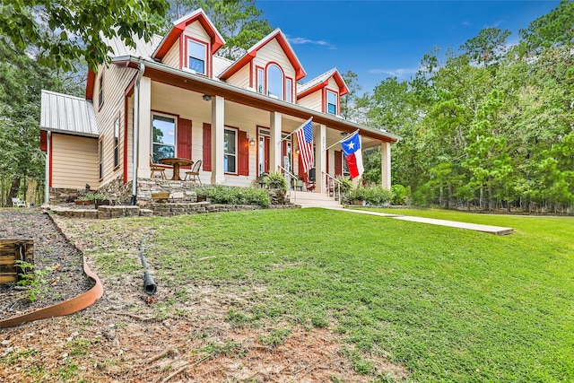 view of front facade featuring a front lawn and covered porch