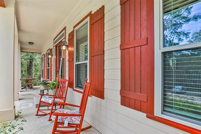 view of exterior entry with covered porch