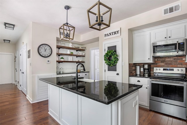 kitchen featuring white cabinets, open shelves, appliances with stainless steel finishes, dark wood-type flooring, and visible vents