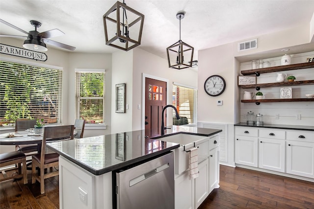 kitchen with white cabinetry, dishwasher, and dark countertops