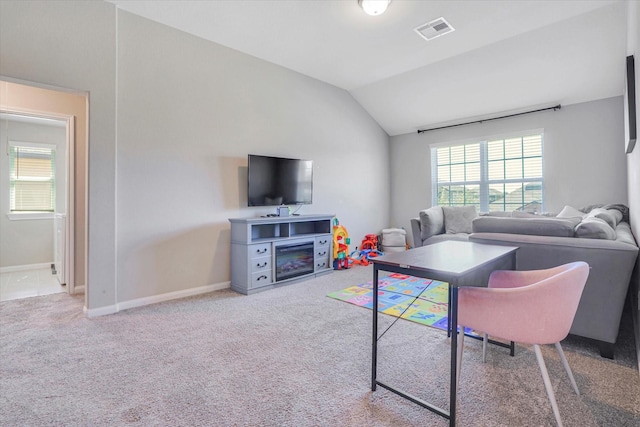 4418 Windflower Valley Ln, Katy, TX 77493 - living area with vaulted ceiling, baseboards, and carpet flooring