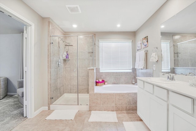 4418 Windflower Valley Ln, Katy, TX 77493 - full bath with a shower stall, tile patterned floors, recessed lighting, a garden tub, and vanity