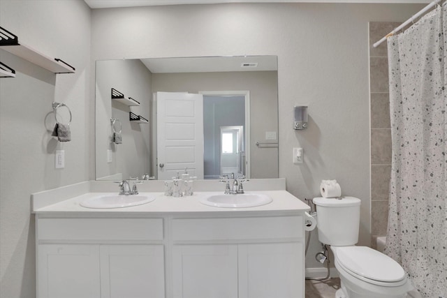 4418 Windflower Valley Ln, Katy, TX 77493 - bathroom with double vanity, toilet, and shower / tub combo with curtain