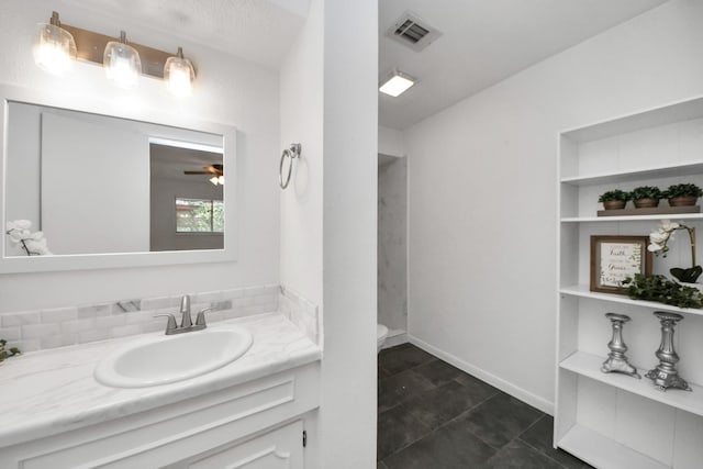 bathroom with ceiling fan, visible vents, built in features, vanity, and toilet