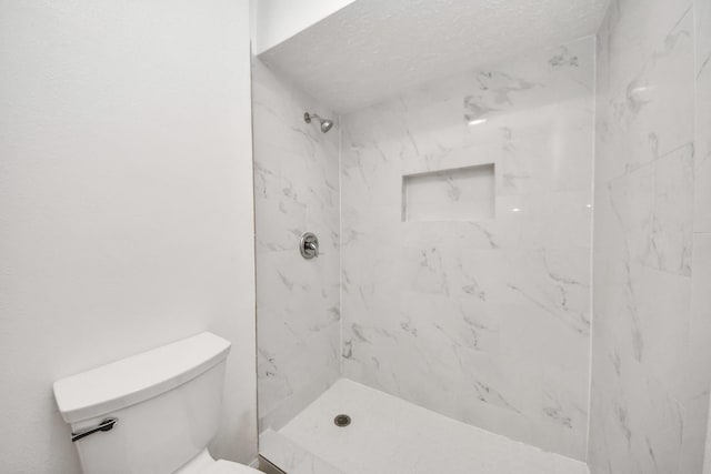 full bath with toilet and a marble finish shower