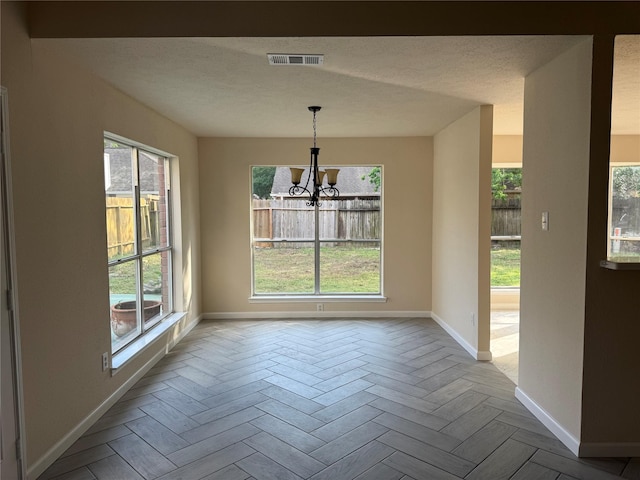 16319 Chimneystone Dr, Houston, TX 77095 - unfurnished dining area featuring baseboards and a chandelier