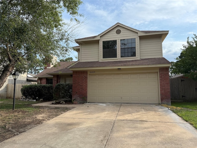 16319 Chimneystone Dr, Houston, TX 77095 - traditional-style house with brick siding, an attached garage, and concrete driveway