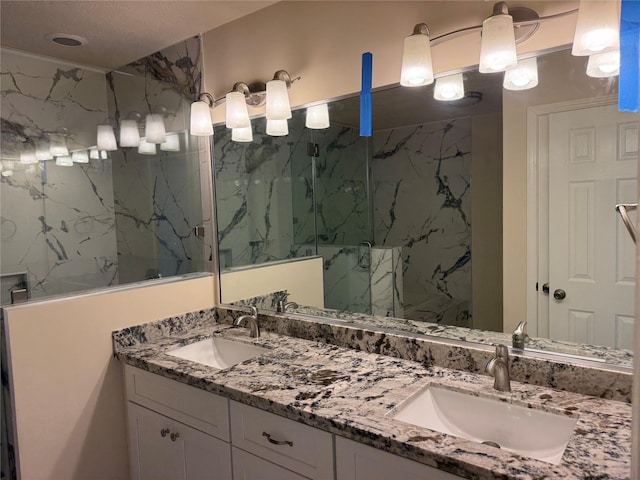 16319 Chimneystone Dr, Houston, TX 77095 - bathroom featuring a marble finish shower and double vanity