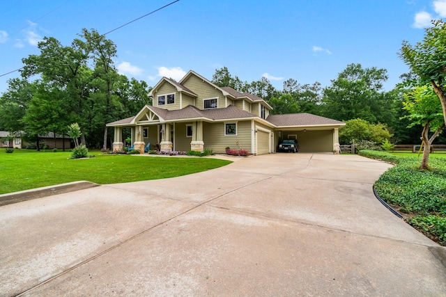 view of front of home with a front lawn, covered porch, a shingled roof, concrete driveway, and an attached garage