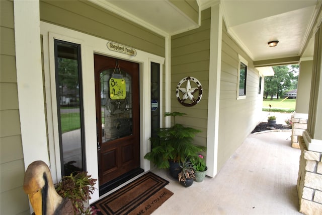 property entrance featuring covered porch