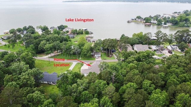 drone / aerial view featuring a residential view and a water view