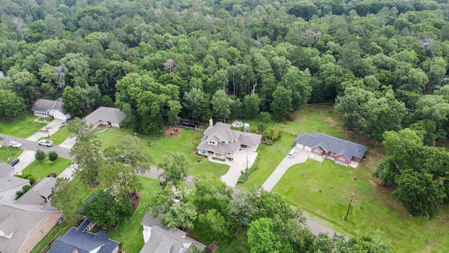 birds eye view of property with a residential view and a forest view