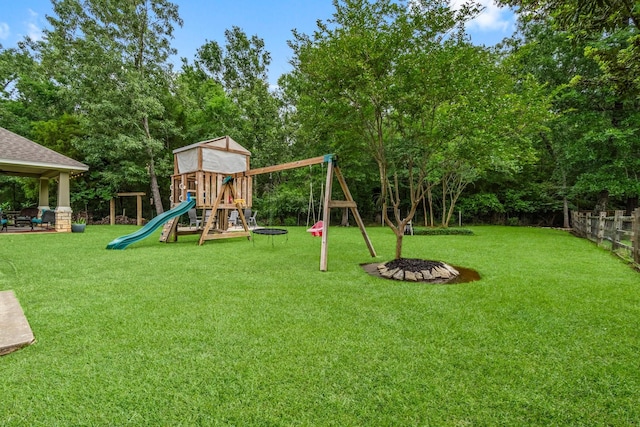 view of play area featuring a fenced backyard and a yard