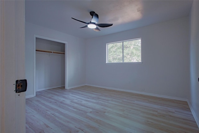 1719 Wagon Gap Trl, Houston, TX 77090 - unfurnished bedroom with light wood-type flooring, baseboards, a closet, and ceiling fan