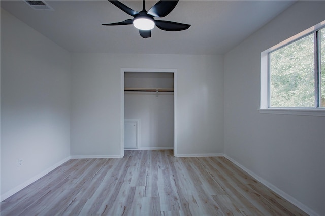 1719 Wagon Gap Trl, Houston, TX 77090 - unfurnished bedroom with wood finished floors, baseboards, and a closet