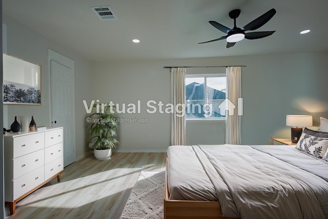 1719 Wagon Gap Trl, Houston, TX 77090 - bedroom with wood finished floors, baseboards, recessed lighting, and a ceiling fan