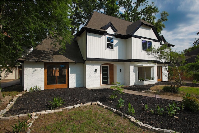 1719 Wagon Gap Trl, Houston, TX 77090 - modern farmhouse style home featuring brick siding and roof with shingles