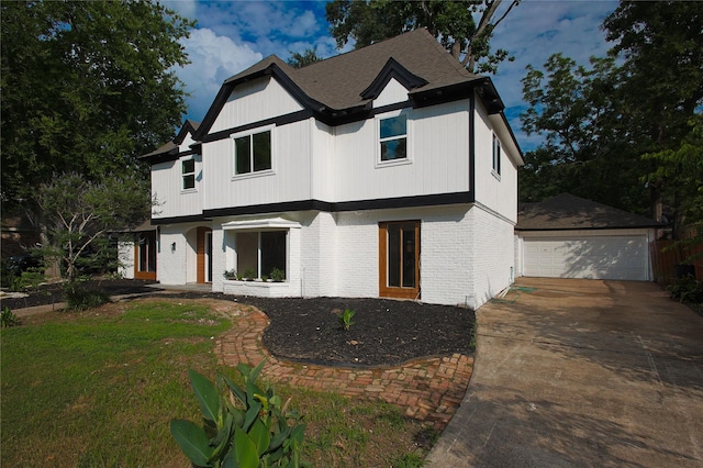 1719 Wagon Gap Trl, Houston, TX 77090 - modern farmhouse style home featuring brick siding, an outdoor structure, and a detached garage