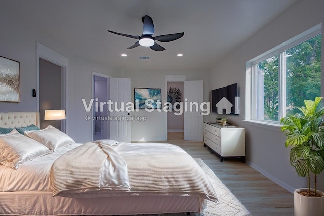 1719 Wagon Gap Trl, Houston, TX 77090 - bedroom featuring light wood finished floors, baseboards, recessed lighting, and ceiling fan