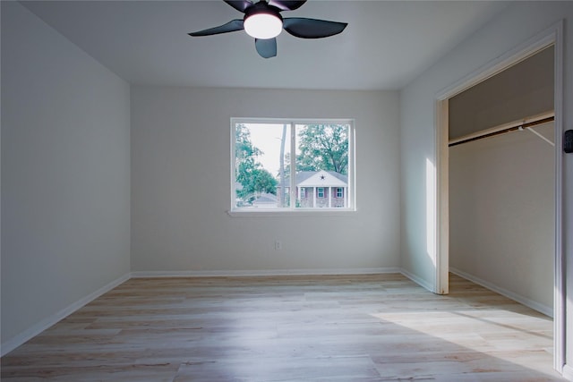 1719 Wagon Gap Trl, Houston, TX 77090 - unfurnished bedroom with light wood finished floors, a closet, and baseboards