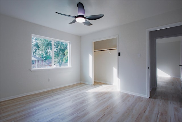 1719 Wagon Gap Trl, Houston, TX 77090 - unfurnished bedroom with light wood-style flooring, baseboards, a closet, and a ceiling fan